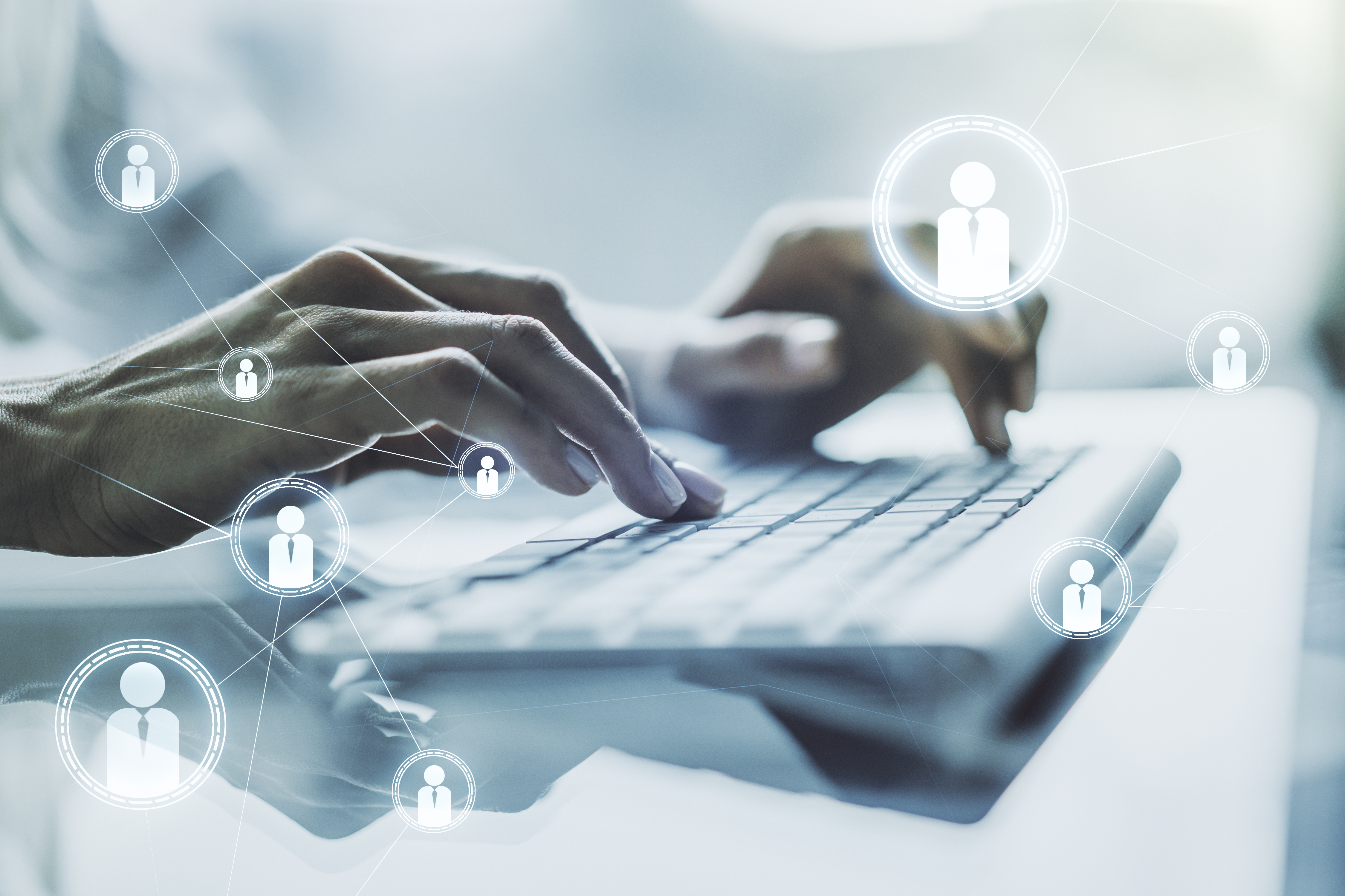 hands typing on a keyboard